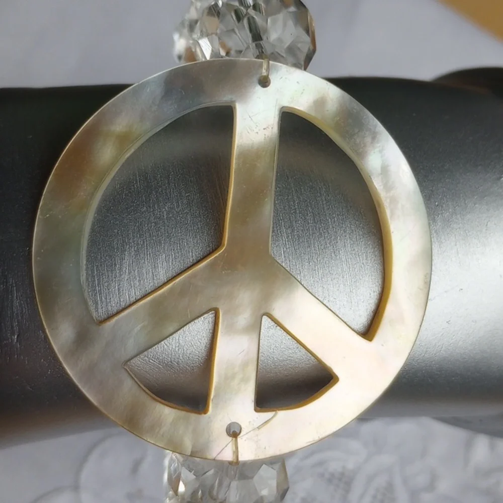 Large faceted Crystal beads w mother of pearl peace sign stretch bracelet